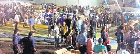Volunteers sorting out relief materials at a collection centre set up in Palakkad