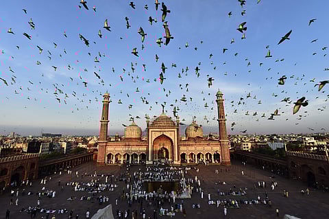 Bakrid is the Muslim festival of sacrifice and marks the end of Haj Pilgrimage. Indians are offering prayers and awaiting the Eid special delicacies of 'Gosht' and 'Biriyani'. IN PIC: New-Delhi Muslims gather to offer 'Eid prayers' on early Wednesday morn