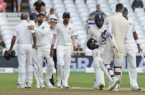 Indian cricket captain Virat Kohli, second left, congratulates teammates after they won the third Test match against England by 203 runs at Trent Bridge in Nottingham, England, Wednesday, Aug. 22, 2018. | AP