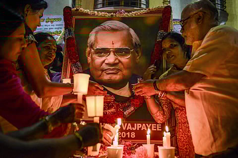 BJP members hold candles to pay tribute to former prime minister Atal Bihari Vajpayee in Bengaluru on August 17 2018. | (File | PTI)