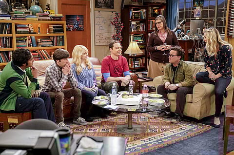 This image released by CBS shows Kunal Nayyar, from left, Simon Helberg, Melissa Rauch, Jim Parsons, Mayim Bialik, Johnny Galecki and Kaley Cuoco appear in a scene from the long-running comedy series 'The Big Bang Theory.' The popular series will end in 2