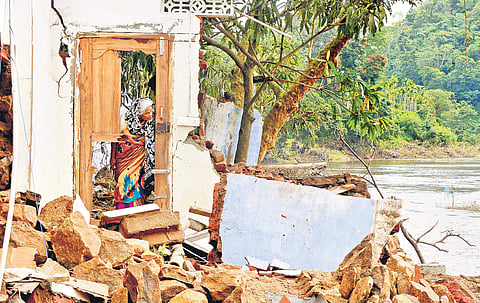 Jameela Pappu of Karimkulam Chappathu in Idukki stands aghast at the sight of her house ravaged by flood waters | Vincent Pulickal