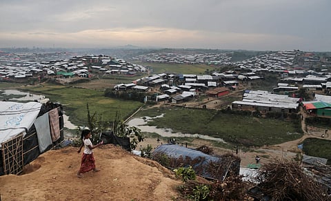 In this Nov. 17, 2017, file photo, a Rohingya Muslim child who crossed over from Myanmar into Bangladesh, plays in front of her makeshift tent at Jamtoli refugee camp in Ukhiya, Bangladesh. (File Photo | AP)