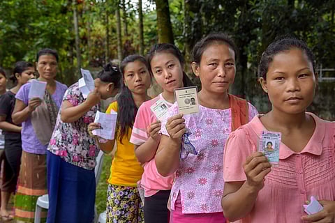 People stand in queue as they wait to cast their votes at Walbakgre Polling Station under South Tura Constituency | PTI