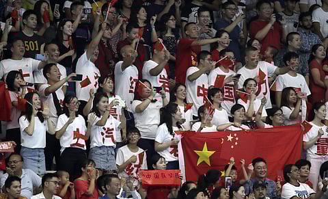 Chinese fans cheering during an event at the ongoing 18th Asian Games | AP