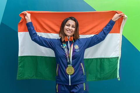 Indian shooter Heena Sidhu poses with the tricolour after winning bronze medal in the 10m Air Pistol at the 18th Asian Games Jakarta Palembang 2018 in Indonesia. (Photo | PTI)
