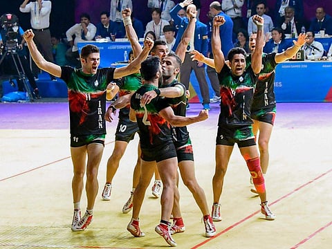 Iran players celebrate after beating India in the Kabaddi semis at Asian Games on Thursday. (Photo | PTI)