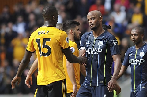 Manchester City's Vincent Kompany shakes hands with Wolverhampton Wanderers' Willy Boly, left, at the end of the English Premier League soccer match. (Photo | AP)
