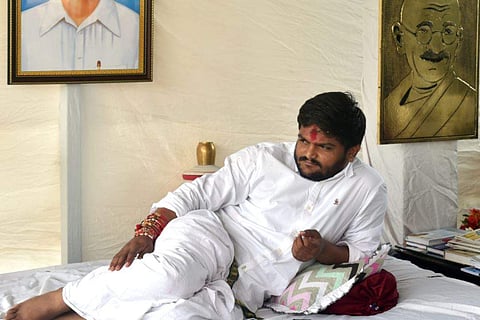 Patidar Anamat Andolan Samiti PAAS leader Hardik Patel sits on an indefinite hunger strike for reservation in Ahmedabad on Sunday August 26 2018. | PTI