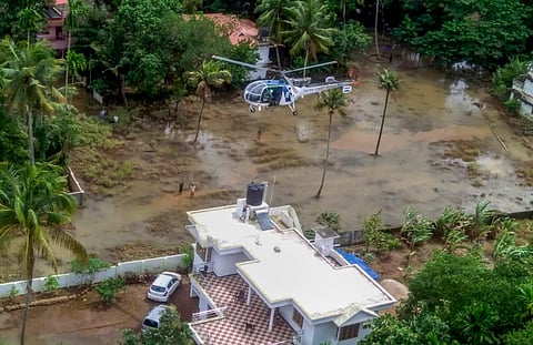 An Indian Coast Guard chopper engaged in the rescue ops in flood-ravaged Kerala. (File photo | PTI)