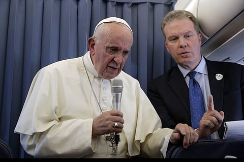 Pope Francis, flanked by Vatican spokesperson Greg Burke, listens to a journalist's question during a press conference aboard of the flight to Rome at the end of his two-day visit to Ireland, Sunday, Aug. 26, 2018. (Photo | AP)