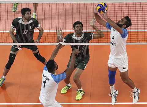 Rajit Singh of India, foreground, plays against Pakistan during their men volleyball match at the 18th Asian Games in Jakarta. (Photo | AP)