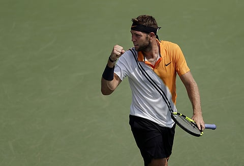 Jack Sock reacts after winning a point against Guido Andreozzi during the first round of the US Open tennis tournament. | AP