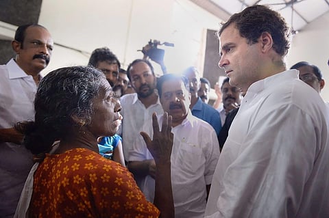 Congress President Rahul Gandhi interacts with the flood-affected people at a relief camp in Chengannur Kerala on Tuesday. (Photo | PTI)