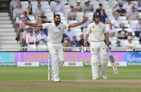 India's Mohammed Shami makes an unsuccessful appeal for the dismissal of England's Jos Buttler, right, during the fourth day of the third Test match between England and India at Trent Bridge in Nottingham, England, Tuesday, Aug. 21, 2018. | AP