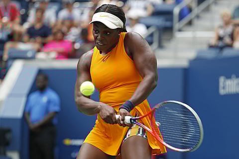 Sloane Stephens returns a shot to Evgeniya Rodina, of Russia, during the first round of the US Open tennis tournament. | AP