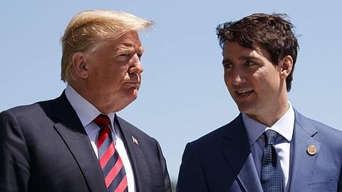Donald Trump talks with Canadian Prime Minister Justin Trudeau.