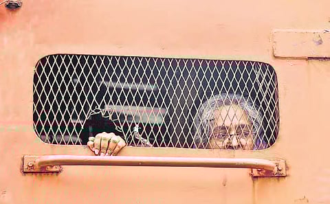 A supporter of Varavara Rao being taken away in a police van in Hyderabad on Wednesdday | R Satish Babu