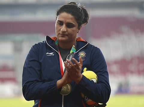 Women's discus throw bronze medalist India's Seema Punia stands on the podium during the athletics competition at the 18th Asian Games in Jakarta, Indonesia, Thursday, Aug. 30, 2018. | AP