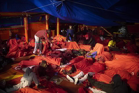 In this Monday, July 30 , 2018 photo, migrants rest inside a rescue vessel at the port of Algeciras, southern Spain, after being rescued by Spain's Maritime Rescue Service in the Strait of Gibraltar. (Photo | AP)