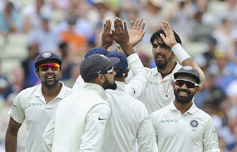 India's Ishant Sharma, without cap, celebrates with teammates the dismissal of England's Ben Stokes during the third day of the first test cricket match between England and India at Edgbaston in Birmingham, England, Friday, Aug. 3, 2018. (AP Photo/Rui Vie