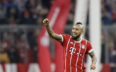 In this Nov. 18, 2017 file photo, Bayern's Arturo Vidal celebrates after scoring his side's opening goal during the German Soccer Bundesliga match between FC Bayern Munich and FC Augsburg, in Munich, Germany. | AP