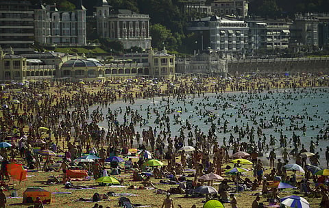 People crowd La Concha beach in the basque city of San Sebastian, northern Spain. (Photo | AP)