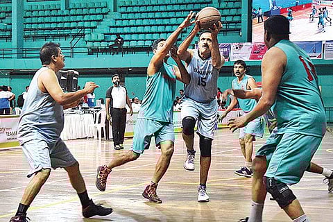 Former India captain Unwin J Antony in action during the veterans basketball match held at the Regional Sports Centre, Kadavanthra, as part of Team Rebound reunion on Saturday  | EXPRESS