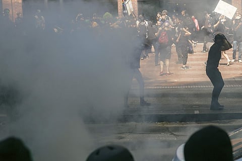 Footage of the Portland rally that drew hundreds showed plumes of smoke as well as a heavy police presence in the city of about 640,000 people. (Photo | AP)