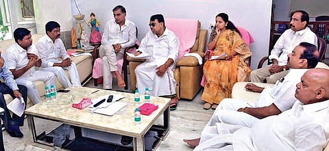 Agriculture Minister Pocharam Srinivas conducts a meeting at his camp office with Irrigation Minister Harish Rao, Nizamabad MP K Kavitha and other political leaders, in Nizamabad on Saturday | Express photo