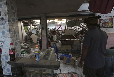 Usable items are salvaged from a home destroyed in an earthquake in North Lombok, Indonesia, Monday, Aug. 6, 2018. (Photo | AP)