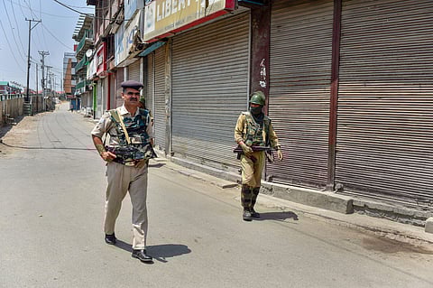 Security personnel patrol a street during a two-day strike called by the separatist leaders against the petitions in the Supreme court challenging the validity of Article 35A in Srinagar on August 5 2018. (Photo | PTI)