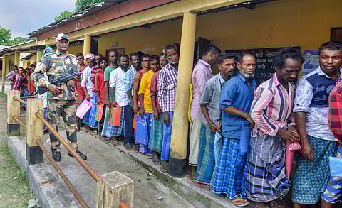 People wait in a queue to check their names on the final draft of the state's National Register of Citizens after it was released at an NRC Seva Kendra in Morigaon on Monday July 30 2018. (File | PTI)