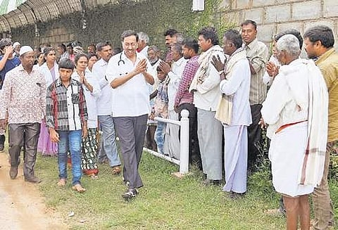 Dr Ramana Rao with patients at his free clinic in rural Karnataka  Nagaraja Gadekal