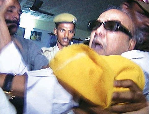 DMK chief M Karunanidhi passed away on Tuesday due to decline in his vital functions. A quick glance at the events through pictures, when the DMK chief was woken up by Tamil Nadu police in July, 2001. (File Photo | PTI)