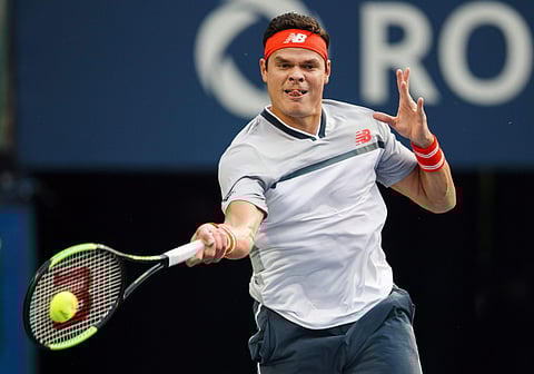 Canada's Milos Raonic returns a shot David Goffin of Belgium during the first round of the Men's Rogers Cup tennis tournament in Toronto, Monday Aug. 6, 2018. (Photo | AP)