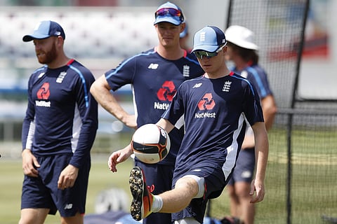 England's new cricket test match squad member Ollie Pope controls a football during a training session at Lord's Cricket ground in London, Tuesday, Aug. 7, 2018. | AP