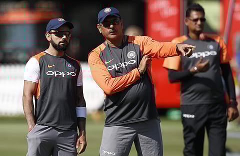 India's head coach Ravi Shastri, right talks to his team captain Virat Kohli during a training session at Lord's Cricket ground in London, Tuesday, Aug. 7, 2018. | AP