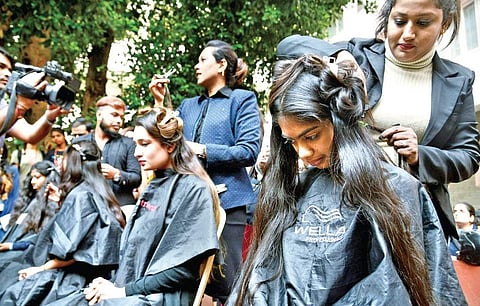 Students donate their hair during a drive at Mount Carmel College as part of a campaign to spread awareness on cancer in Bengaluru on Wednesday | Pushkar V