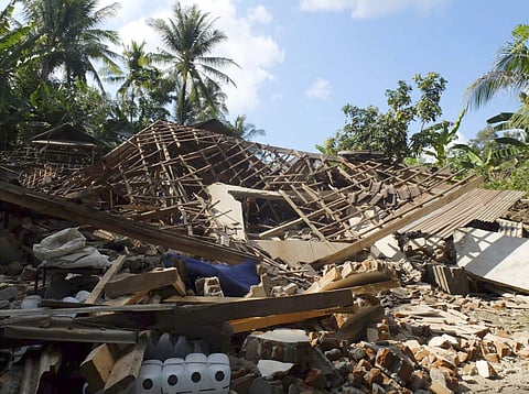 Houses damaged by an earthquake are seen in North Lombok, Indonesia, Monday. (Photo | AP )
