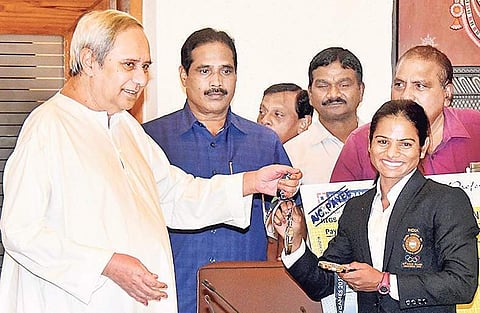 CM Naveen Patnaik felicitating Dutee Chand in Bhubaneswar on Friday