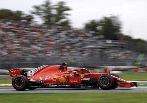 Ferrari driver Sebastian Vettel of Germany steers his car during a free practice at the Monza racetrack, in Monza, Italy, Friday, Aug. 31, 2018. | AP