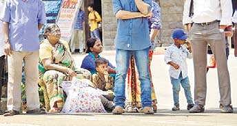 Passengers wait for transportation at Central Railway Station in Thiruvananthapuram after public transport vehicles kept off the road on Monday due to the hartal  B P Deepu
