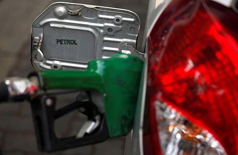 A nozzle pumps petrol into a vehicle at a fuel station in Mumbai, India, May 21, 2018. | Reuters