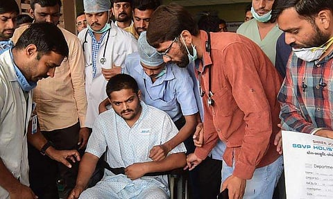 Hardik Patel leaves from the hospital after being discharged. (Photo | PTI)