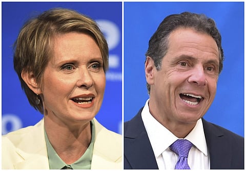 In this combination of file photos, New York gubernatorial candidate Cynthia Nixon, left, speaks during a Democratic primary debate in Hempstead, N.Y., on Aug. 29, 2018, and Gov. Andrew Cuomo speaks at a press conference in New York on July 18, 2018. | As