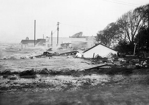 In this October 15, 1954 file photo, High tides, whipped in by Hurricane Hazel, shatter boats and buildings in Swansboro, N.C., as the storm lashes the Atlantic seaboard.  (Photo | AP)