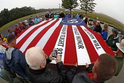 Visitors to the Flight 93 National Memorial in Shanksville, Pa., participate in a sunset memorial service on Monday, Sept. 10, 2018, as the nation marks the 17th anniversary of the Sept. 11, 2001 attacks. (Photo | AP)