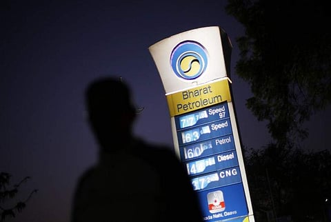 A Bharat Petroleum oil pump station displays the price of unleaded petrol and Diesel as a pedestrian walks past in New Delhi, February 3, 2016. | Reuters