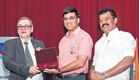 Sergey L Kotov, Consul General of the Russian Federation in Chennai, conferring Viswanathan Anand (C) with ‘Order of Friendship’ at Russian Center of Science and Culture in Chennai on Monday. Also present is P Balakrishna Reddy (R), TN Minister for Youth 